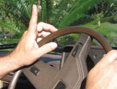Grey nomads wave at other motorists