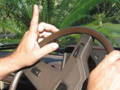 Grey nomads wave at other motorists