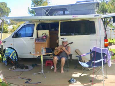 guitar playing grey nomad