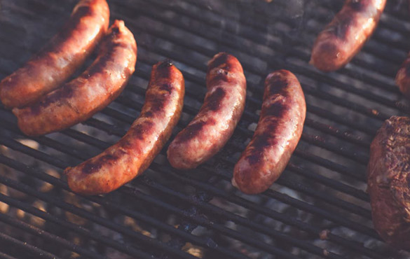 grey nomads cooking sausages