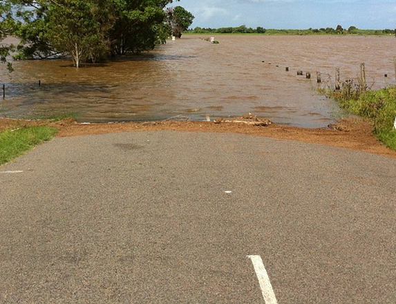 motorhome submerged in flooded road
