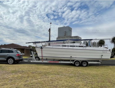 Grey nomads in boat on land